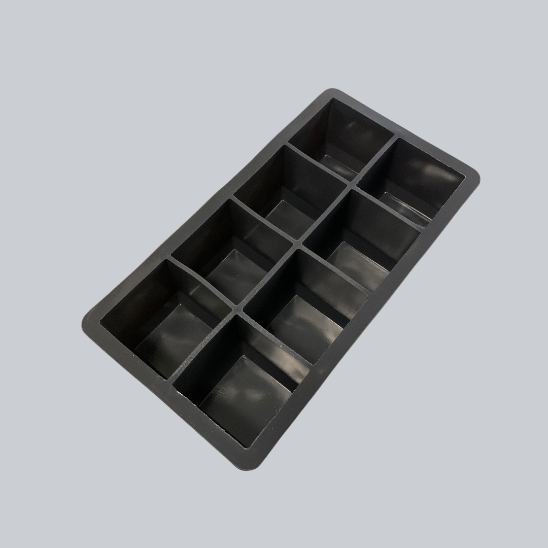 Black silicone ice cube tray with 10 large square compartments.
