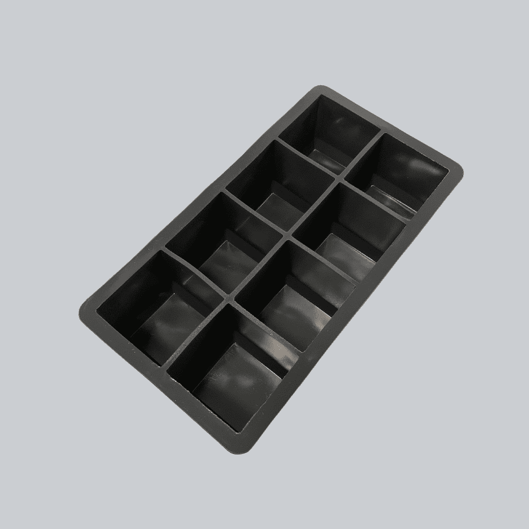 Black silicone ice cube tray with 10 large square compartments.