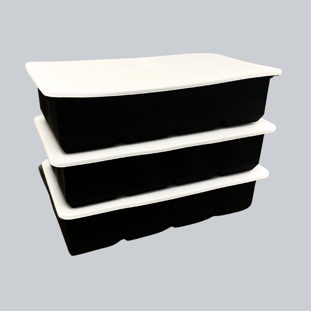 Stacked black storage tubs with white lids for organized storage.